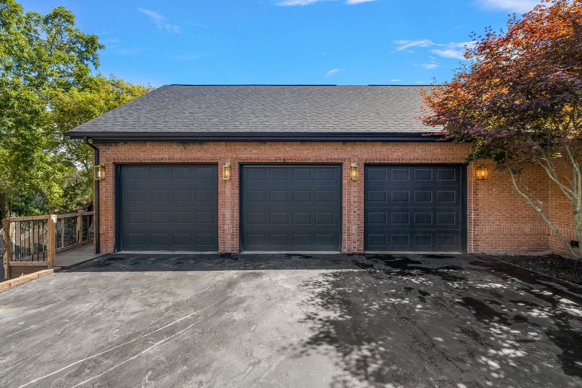 Finished garage and driveway exterior.