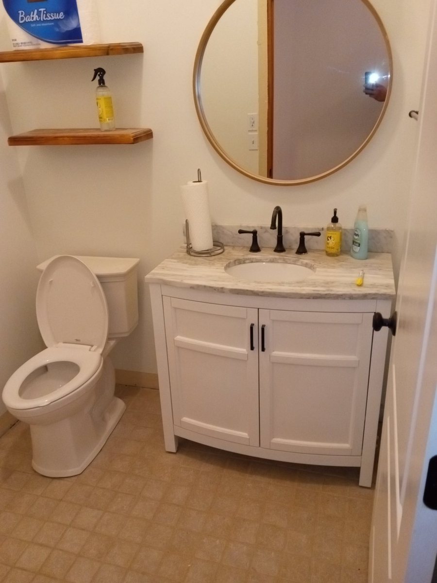Bathroom vanity and fixture area during finish work.