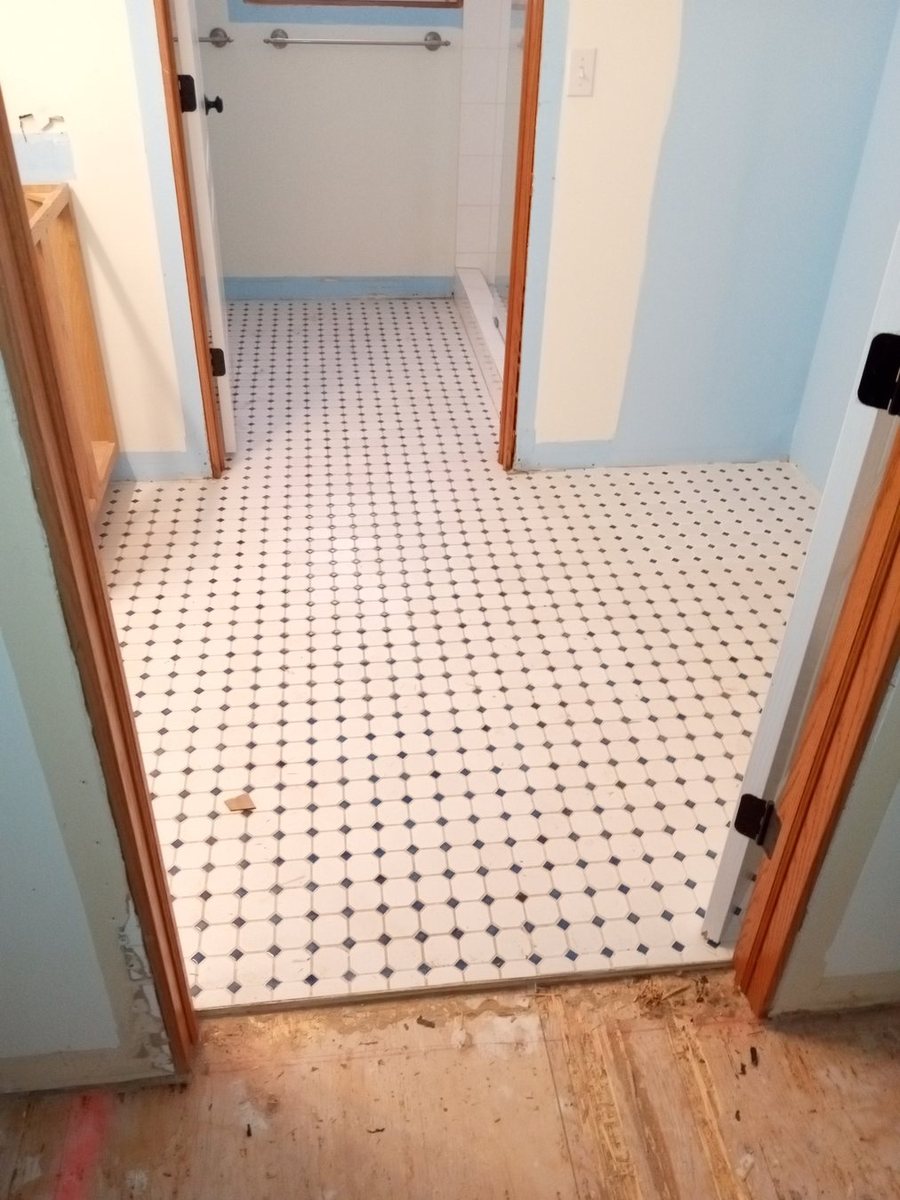 Bathroom tile work prepared for finish detail.